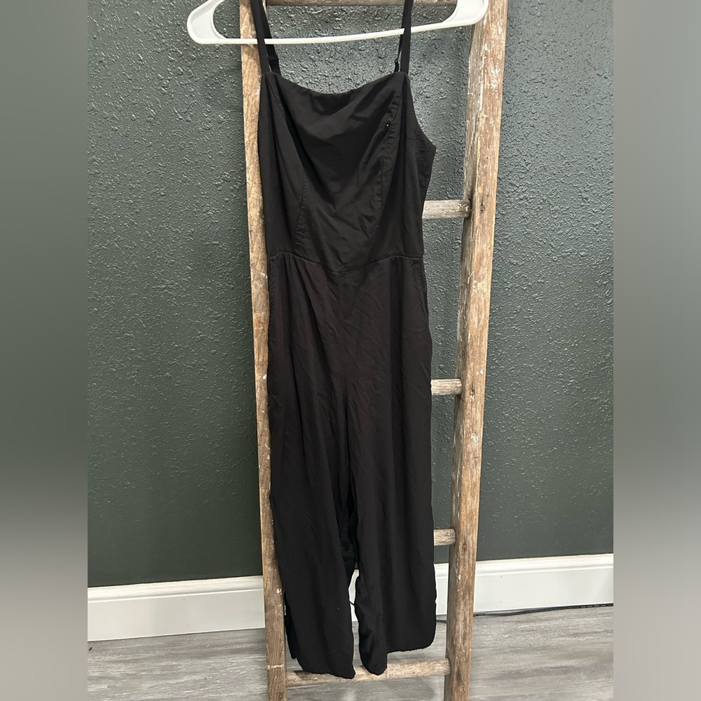 Woman’s black romper/jumpsuit